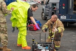 Sgt. Christina Burgess, survey team member with the 63rd Civil Support Team, Oklahoma Army National Guard, discusses chemical detection equipment with a member of the Midwest City Fire Department in Midwest City during an exercise Nov. 20.