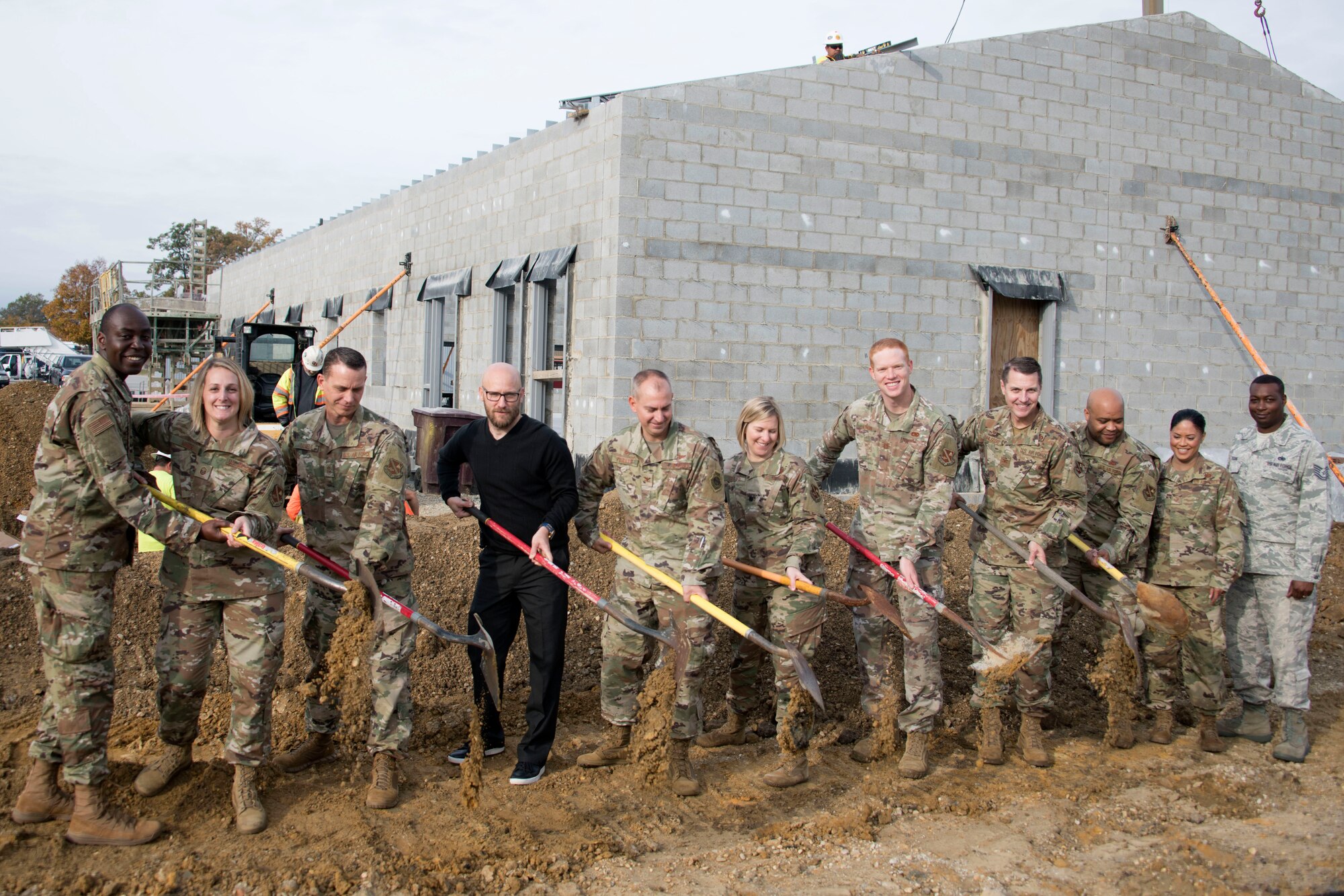 Joint Base Andrews leadership pose for a ceremonial groundbreaking photo, Joint Base Andrews, Md., Oct. 10, 2019. The new building being constructed will consolidate the 11th Logistics Readiness Squadron into one central building.