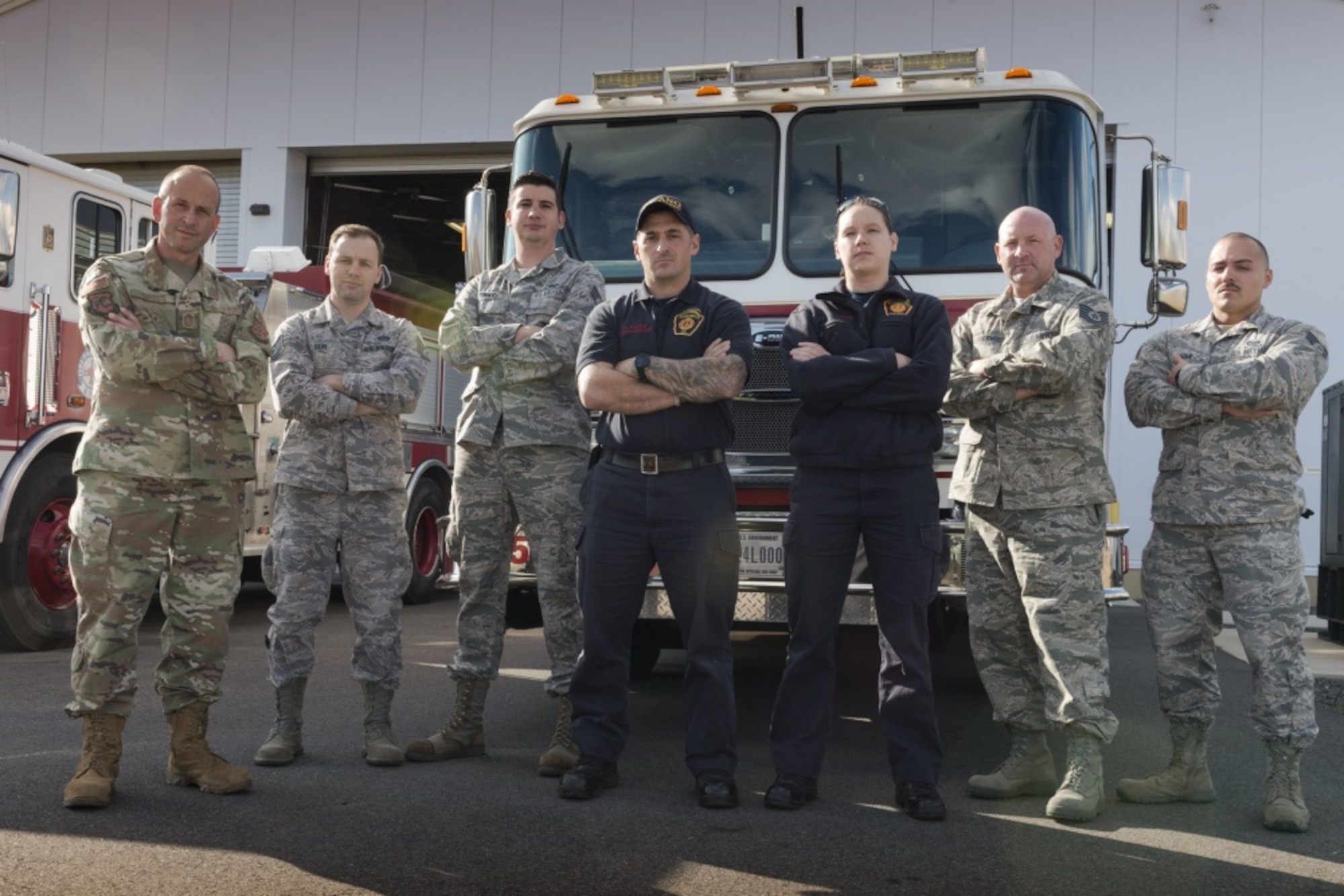 U.S. Air Force Chief Master Sgt. Robert Cross, Tech. Sgt. Craig Bein, Senior Airman Jason Conway, Firefighter Howard Corp, Firefighter Lisa Deakins, Tech. Sgt Ronald Avery, and Senior Airman Gabriel Pagan pose in front of the Bradley Air National Guard Base Fire Station Nov. 3, 2019 East Granby, Conn. These firefighters all responded to the B-17 Flying Fortress crash at Bradley International Airport Oct. 2, 2019. (U.S. Air National Guard photo by Airman 1st Class Chanhda Ly)