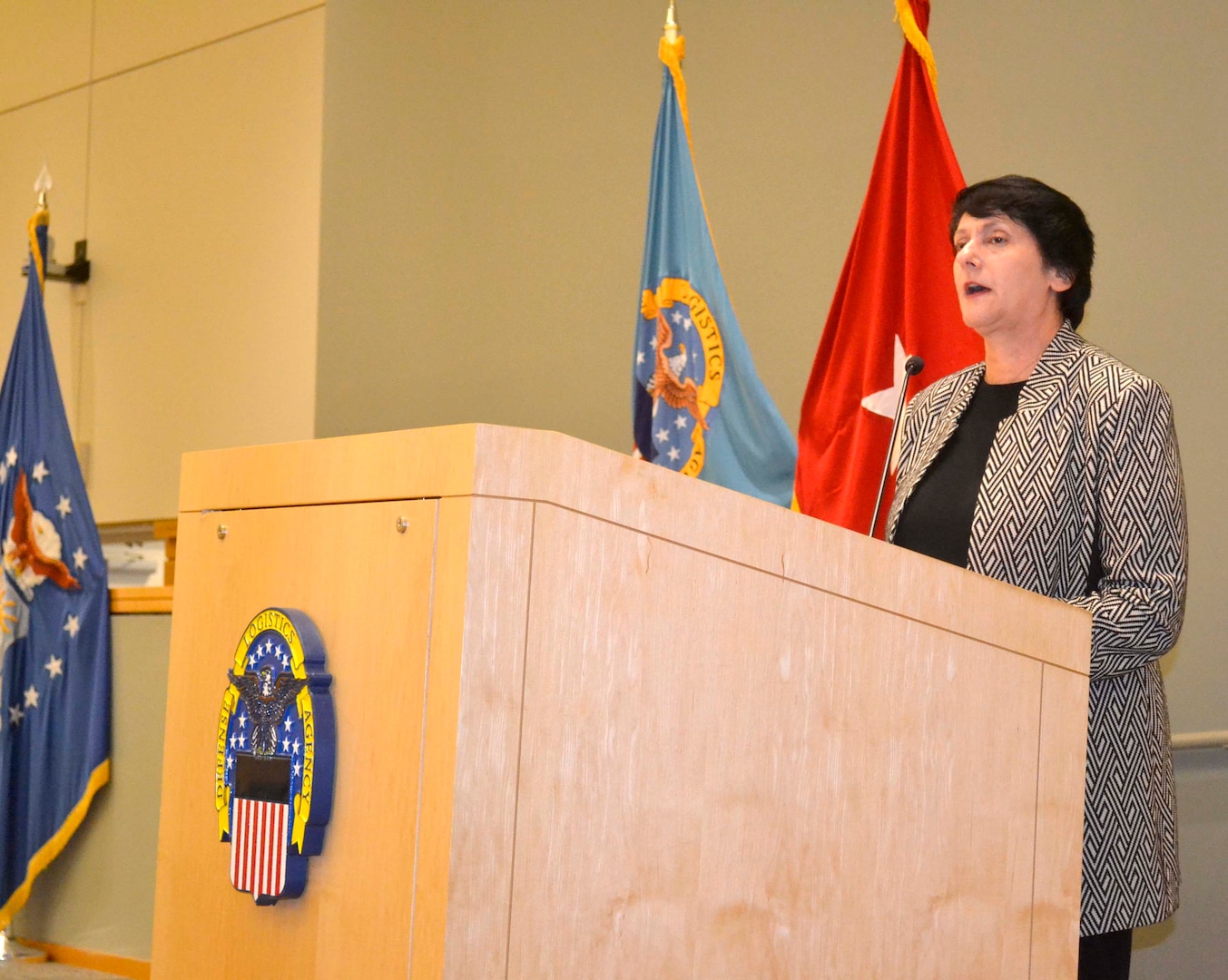 Pam Latker, Defense Logistics Agency Training Career Management Division chief, addresses the latest group of students to graduate the DLA Pathways to Career Excellence Program during a ceremony at the DLA Troop Support headquarters in Philadelphia on Nov. 19, 2019. There were 139 graduates from the two-year program.