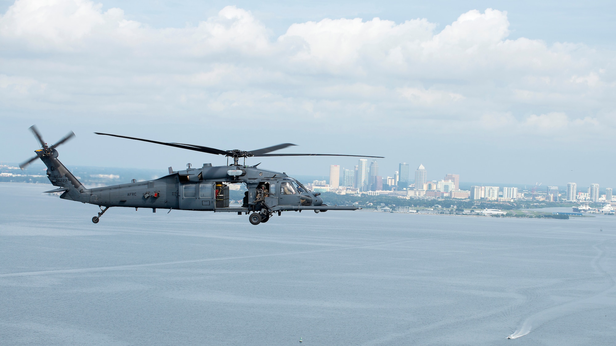 An HH-60 Pave Hawk helicopter assigned to the 305th Rescue Squadron (RQS), Davis-Monthan Air Force Base, Ariz., flies above the waters of Tampa Bay, Fla., Nov. 8, 2019.