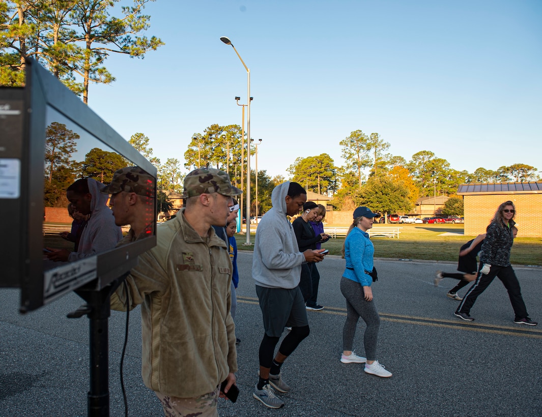 A photo of participants running in the Gobble 'Til You Wobble 5K