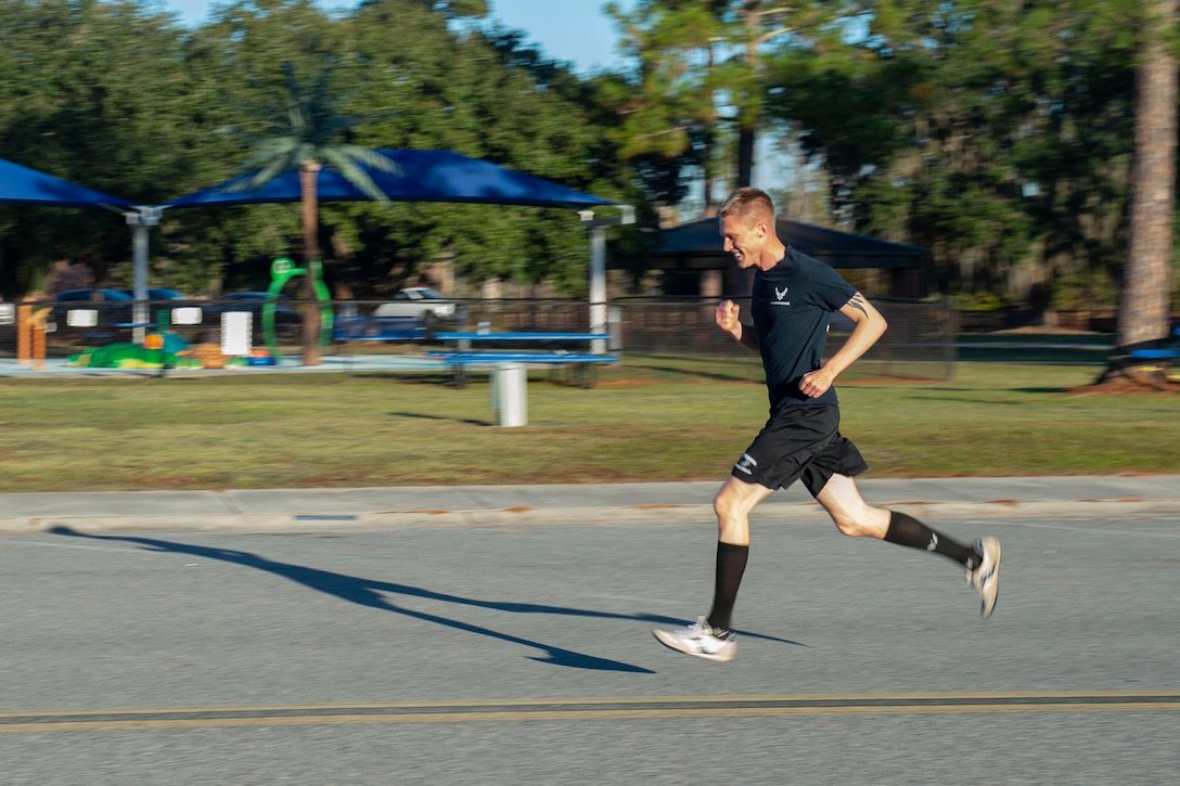 A photo of a participant running toward the finish line during the Gobble 'Til You Wobble 5K