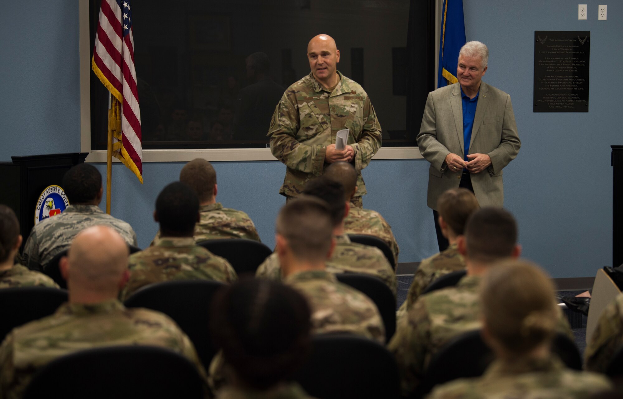 Chief Master Sgt. Anthony Green, the 6th Air Refueling Wing command chief, introduces a developmental special duty vector fair audience to retired Chief Master Sgt. Gerald Murray, the 14th Chief Master Sgt. of the Air Force, during his visit to MacDill Air Force Base, Fla., Nov. 19, 2019.