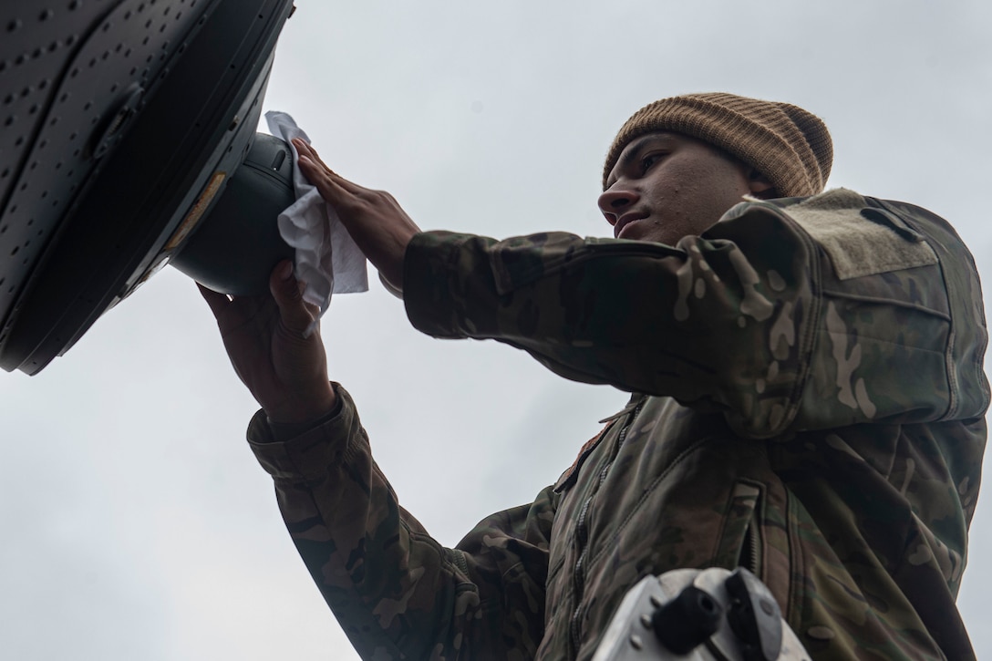A photo of an Airman inspecting an aircraft.