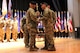 Col. Stallings passes the sword of the noncommissioned officer to Command Sgt. Maj. Russell, incoming command sergeant major, signifying the change of responsibility between Russell and Command Sgt. Maj. Multunas during the Recruiting and Retention College Change of Responsibility that took place at Fort Knox, Kentucky Nov. 21.
