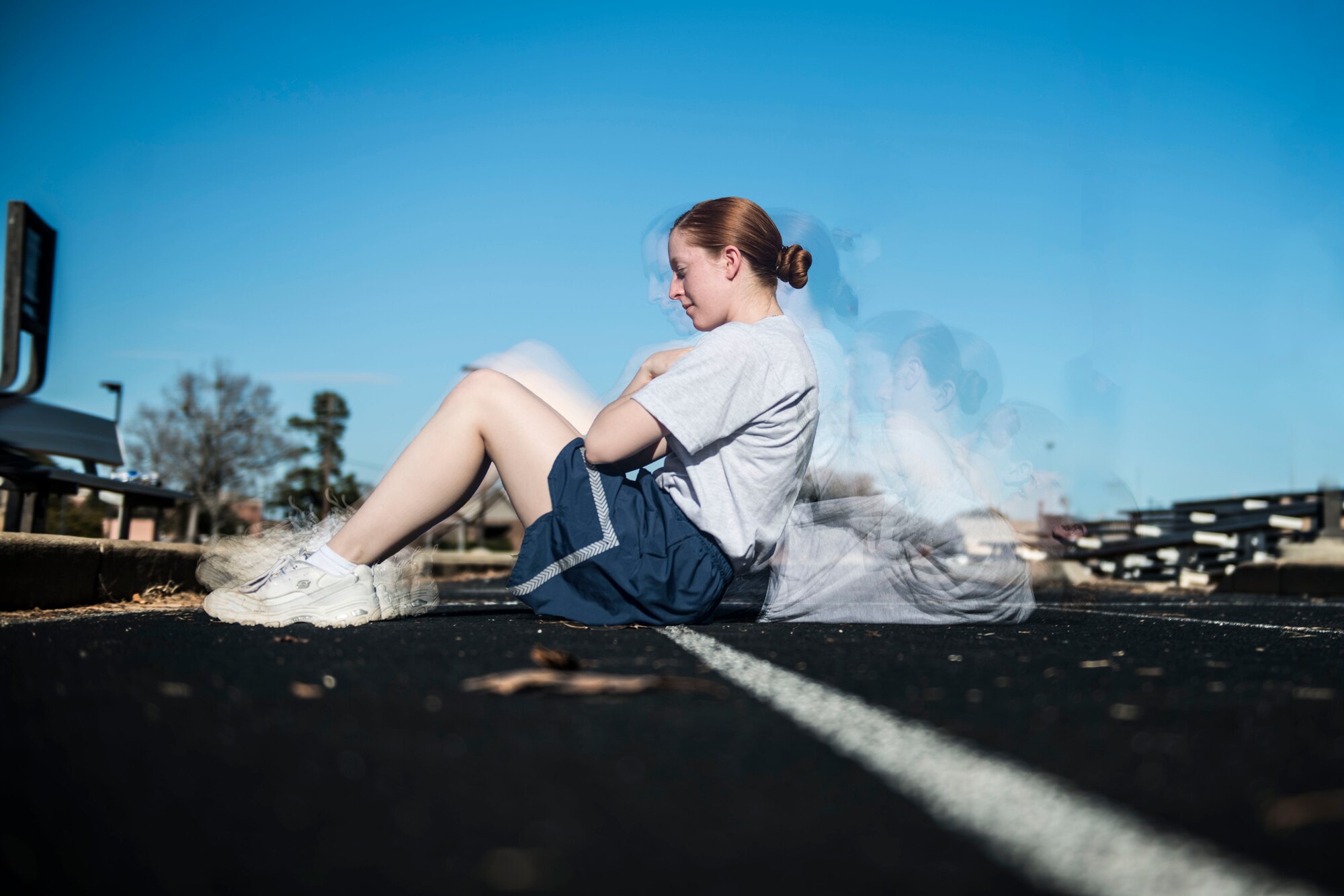 Photo illustration of an Airman doing sit-ups