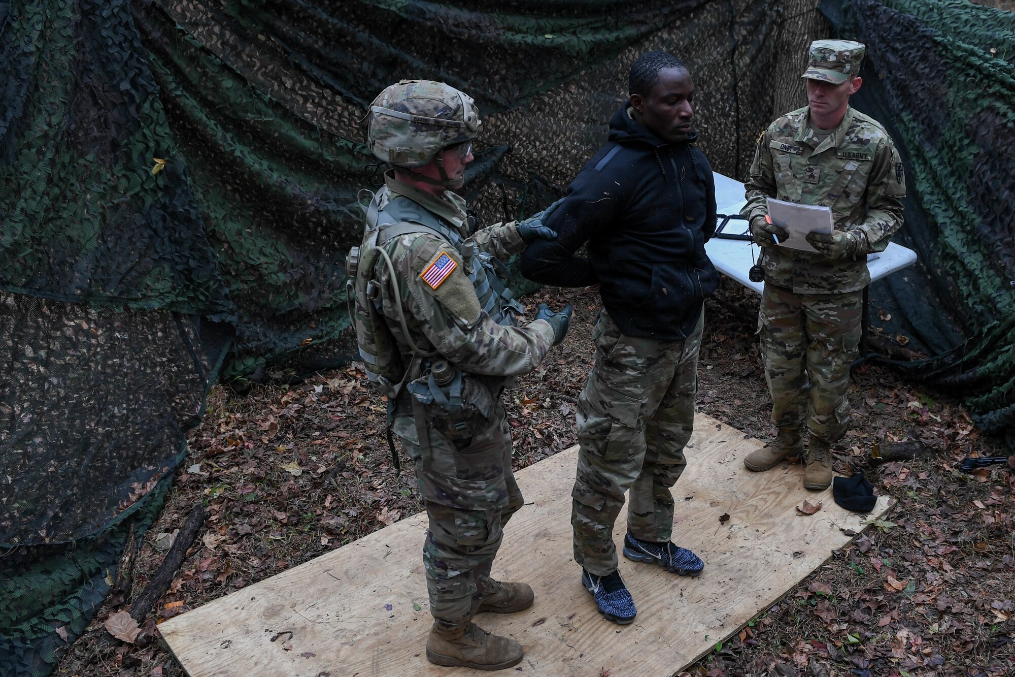 U.S. Army Spc. Keenan Baker, a military policeman with the 108th Military Police at Fort Bragg, searches a suspect during a task in the weapons lane during the Expert Soldier Badge course at Joint Base Langley-Eustis, Virginia, Nov. 18, 2019. To be awarded the ESB, Soldiers must pass 30 tasks designed to enhance the lethality and readiness of the force. (U.S. Air Force photo by Senior Airman Derek Seifert)