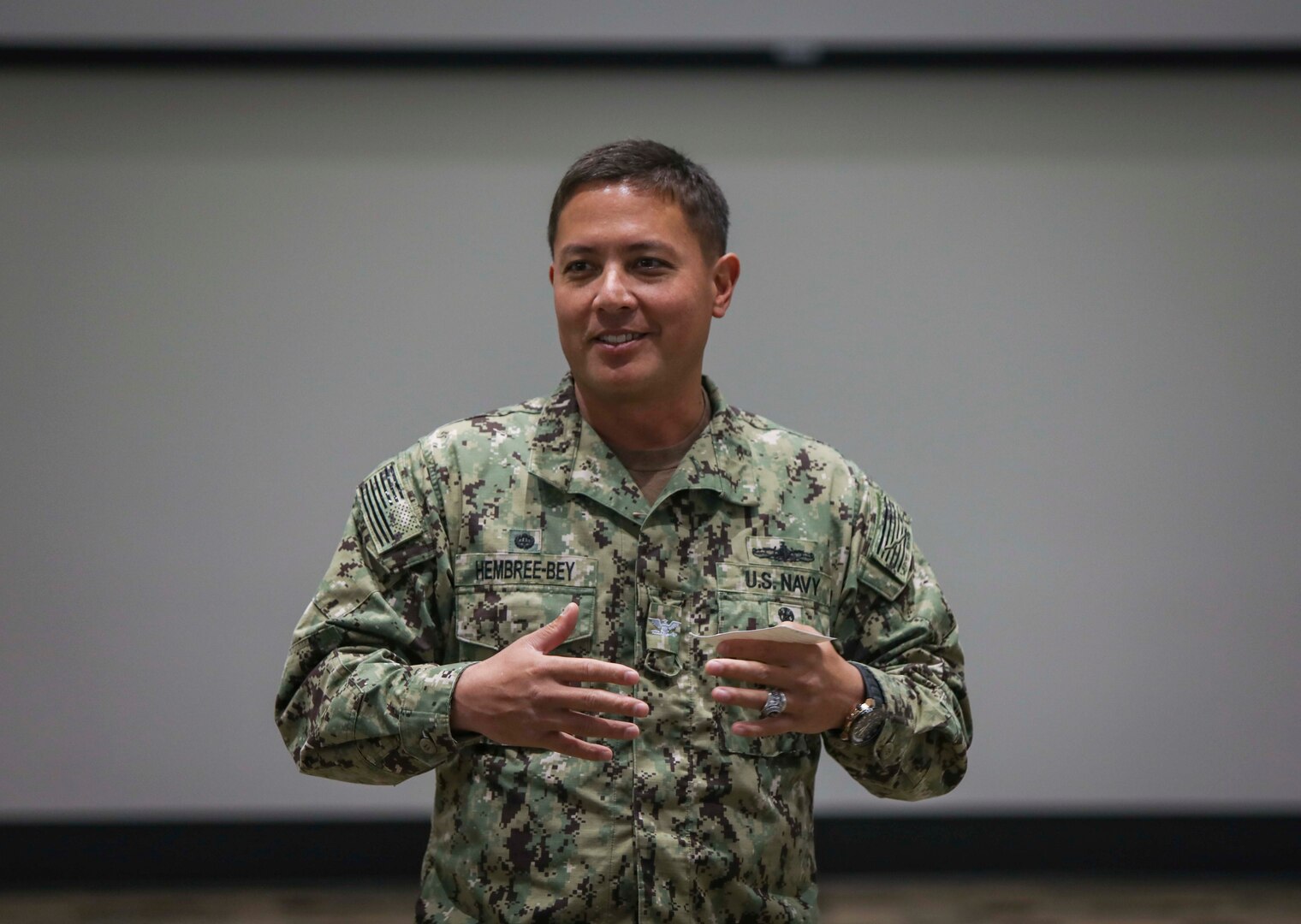 Capt. Khary W. Hembree-Bey, commanding officer of Naval Surface Warfare Center (NSWC) Corona, addresses employees during his monthly town hall meeting.