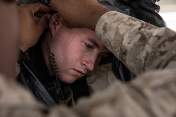 Marine dresses in chemical, biological, radiological, and nuclear defense gear for sensitive site exploitation training during exercise Eager Lion 2019 in Jordan, August 27, 2019 (U.S. Marine Corps/Rhita Daniel)