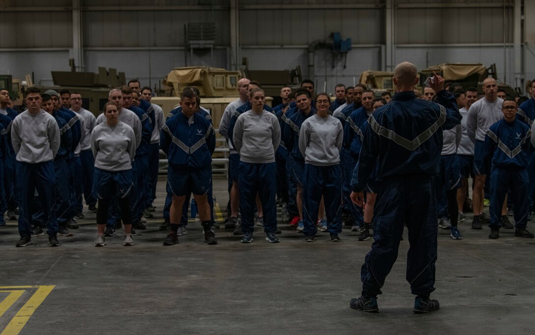 90th Mission Support Group Warrior Day participants stand in formation while receiving the schedule for the warrior ethos challenge Nov. 21, 2019, on F.E. Warren Air Force Base, Wyo. Warrior Day is held quarterly as an educational and morale event to support Airmen and prepare them for situations they may encounter while deployed. (U.S. Air Force photo by Senior Airman Abbigayle Williams)