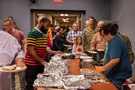 Members of Joint Task Force Civil Support (JTF-CS) and their families get food during the JTF-CS Thanksgiving pot-luck at the command headquarters at Joint Base Langley-Eustis. JTF-CS Morale, Welfare and Recreation (MWR) hosts this event every year to promote comradery, morale and well-being for command personnel, as well as to give their family members a chance to see what JTF-CS is all about. (Official DoD photo by Mass Communication Specialist 3rd Class Michael Redd/RELEASED)