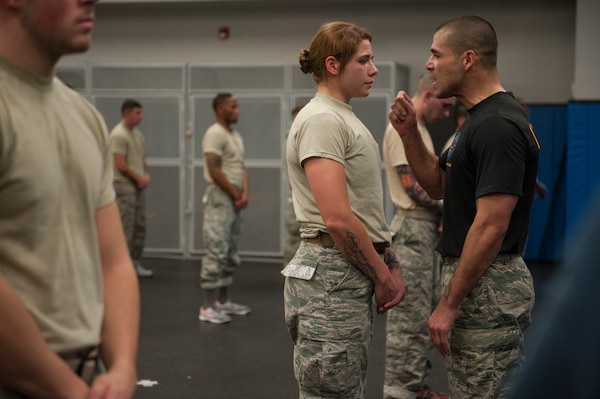 Patrolman with 22nd Security Forces, McConnell Air Force Base, Kansas, receives some motivational words from Phoenix Raven instructor during intensive 3-week, 12-hour-a-day Phoenix Raven Qualification Course at Joint Base McGuire-Dix-Lakehurst, New Jersey (U.S. Air Force/Vernon Young, Jr.)