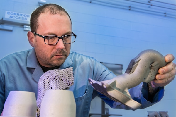 Army researcher Dr. Brandon McWilliams holds sample part created from powder at U.S. Army Combat Capabilities Development Command鈥檚 Army Research Laboratory, Aberdeen Proving Ground, Maryland, February 25, 2019 (U.S. Army/David McNally)