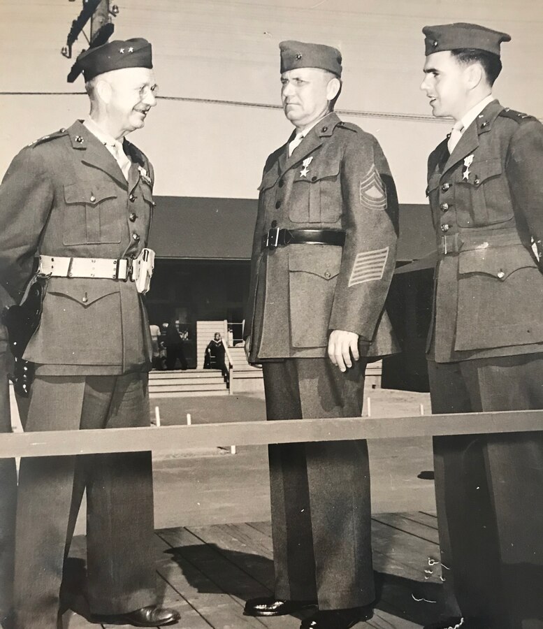 General Holland “Howlin’ Mad” Smith (left) speaks with two Silver Star recipients, one being Captain Robert Haggerty (right).