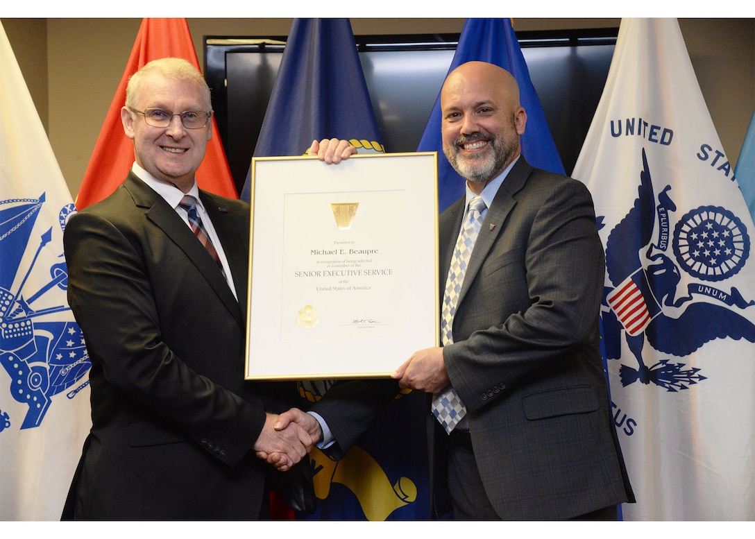 DCMA Deputy Director presents Michael Beaupre with his SES certificate.