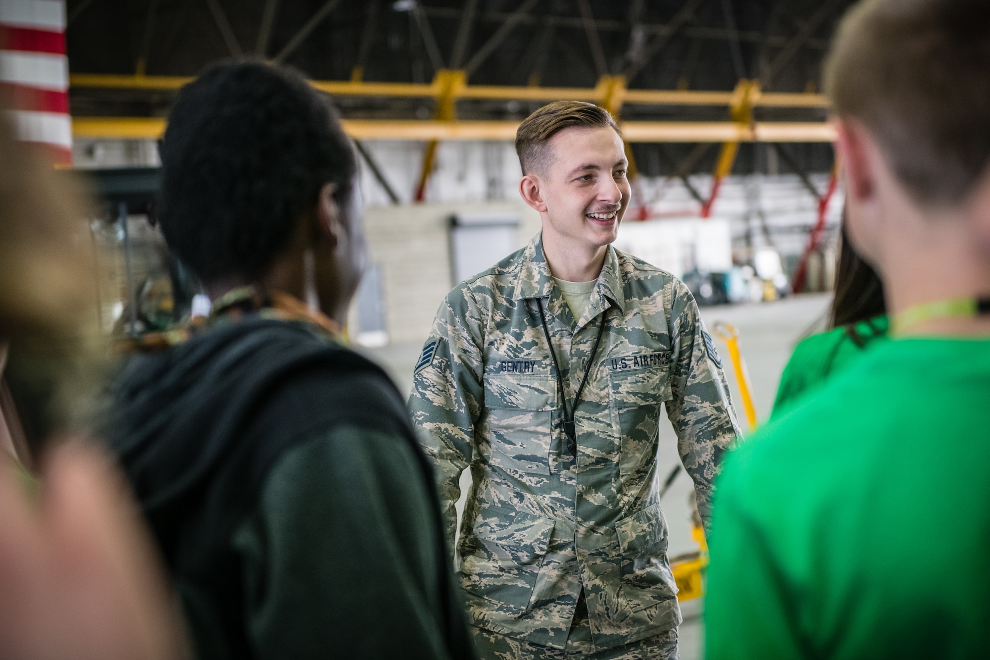 Staff Sgt. Robert Gentry, 932nd Airlift Wing Maintenance Squadron technician, speaks with students about maintenance careers within the Air Force Reserve and challenges students to create and fly paper airplanes during STEAM Day at Scott Air Force Base, Illinois, Nov. 20, 2019. The day inspires kids to explore and pursue their interests in Science, Technology, Engineering, Art and Math.  (U.S. Air Force photo by Christopher Parr)