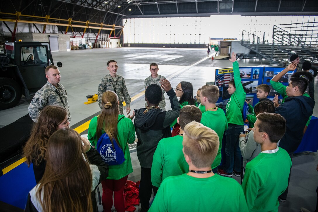 U.S. Air Force Citizen Airmen from the 932nd Airlift Wing Maintenance Squadron  speak with students about maintenance careers within the Air Force Reserve and challenge students to create and fly paper airplanes during STEAM Day at Scott Air Force Base, Illinois, Nov. 20, 2019. The day inspires kids to explore and pursue their interests in Science, Technology, Engineering, Art and Math.  (U.S. Air Force photo by Christopher Parr)