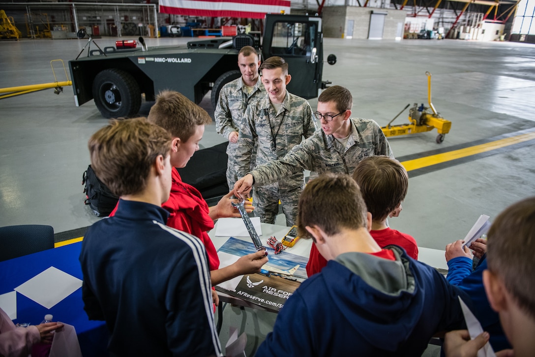 Senior Airman Landon Wineland, 932nd Airlift Wing Maintenance Squadron technician, speaks with students about maintenance careers and some of the equipment used to repair aircrafts during the STEAM Day event  held Nov. 20, 2019, at Scott Air Force Base, Illinois. The day inspires kids to explore and pursue their interests in Science, Technology, Engineering, Art and Math.
(U.S. Air Force photo by Christopher Parr)