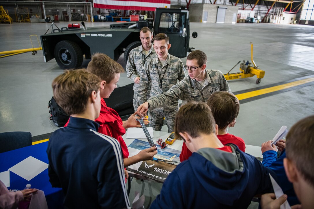 Senior Airman Landon Wineland, 932nd Airlift Wing Maintenance Squadron technician, speaks with students about maintenance careers and some of the equipment used to repair aircrafts during the STEAM Day event  held Nov. 20, 2019, at Scott Air Force Base, Illinois. The day inspires kids to explore and pursue their interests in Science, Technology, Engineering, Art and Math.
(U.S. Air Force photo by Christopher Parr)
