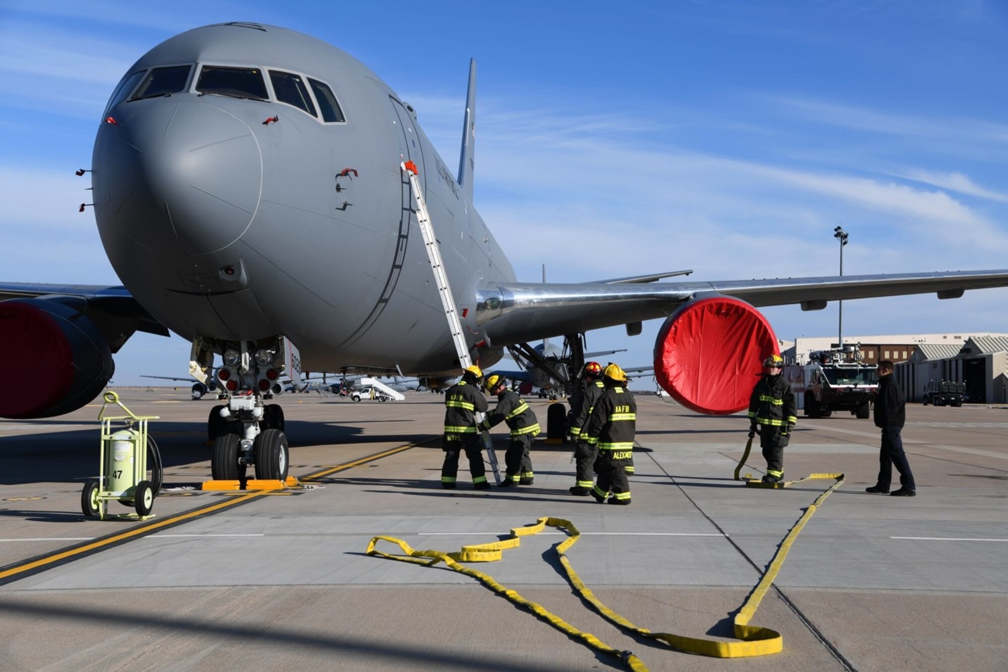 McConnell firefighters demonstrate how to properly gain access into a KC-46 Pegasus during the KC-46 Firefighter Symposium Nov. 13, 2019 at McConnell Air Force Base, Kan. A total of 12 firefighters across all Air force Fire and Emergency Services organizations had the opportunity to participate in the three-day training. (U.S. Air Force photo by Airman 1st Class Nilsa E. Garcia)