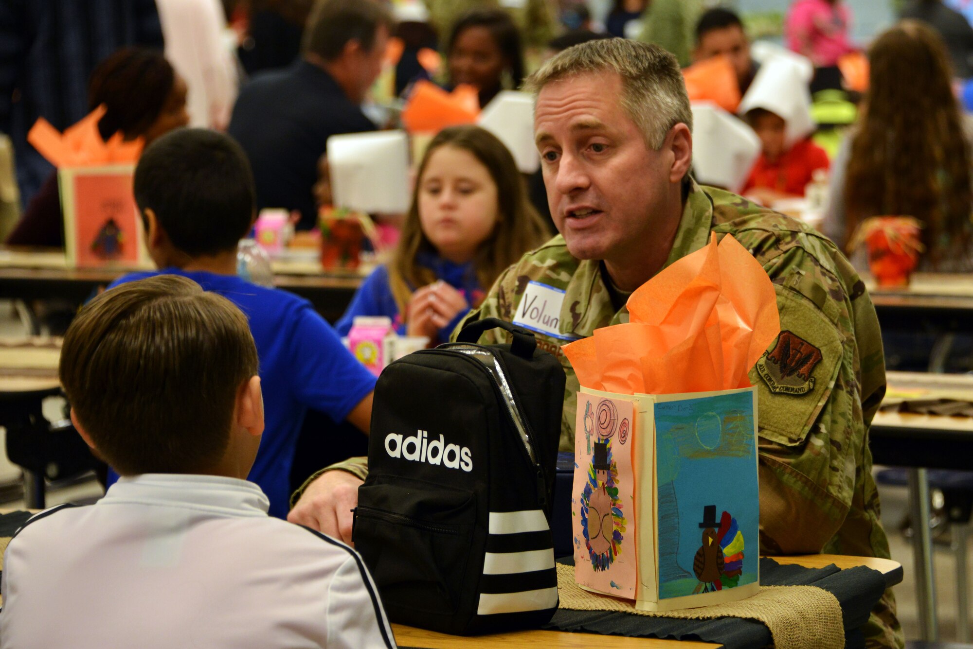 Airmen stationed at Tyndall Air Force Base, Florida, attended a Thanksgiving holiday lunch at Northside Elementary School in Panama City, Florida, Nov. 21, 2019. Team Tyndall members helped serve food and also engaged with children whose families were not able to attend the event. Team Tyndall members donate hundreds of hours of volunteer work each year to help support the local community. (U.S. Air Force photo by 2nd Lt. Kayla Fitzgerald)