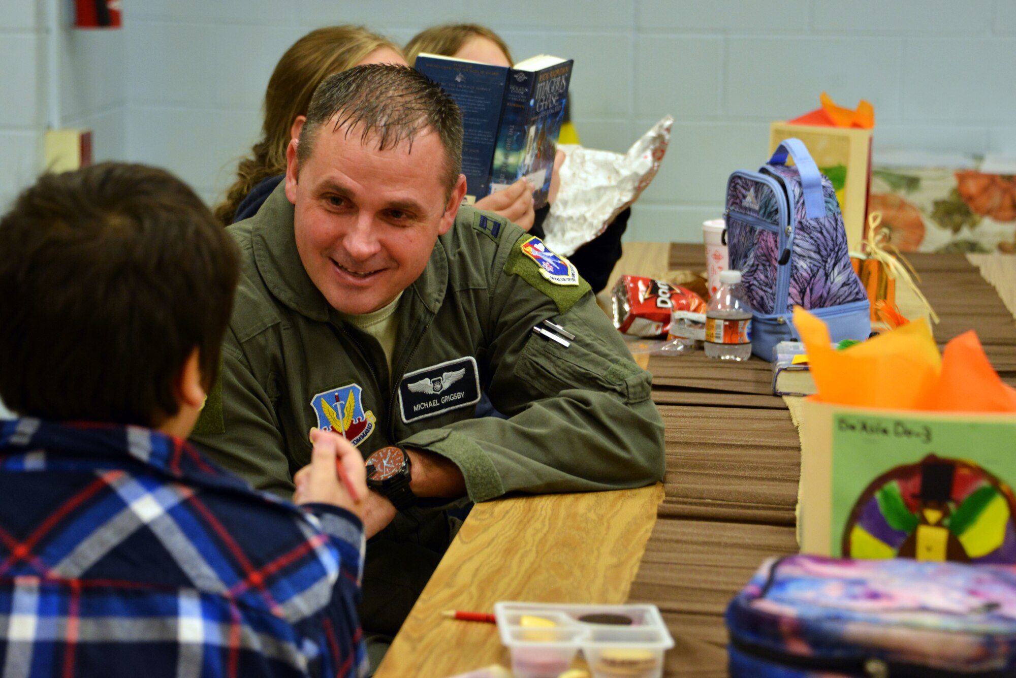 Capt. Michael Grigsby, 601st Air Operations Center strategic planner at Tyndall Air Force Base, Florida, attended a Thanksgiving holiday lunch at Northside Elementary School in Panama City, Florida, Nov. 21, 2019. Team Tyndall members helped serve food and also engaged with children whose families were not able to attend the event. Team Tyndall members donate hundreds of hours of volunteer work each year to help support the local community. (U.S. Air Force photo by 2nd Lt. Kayla Fitzgerald)