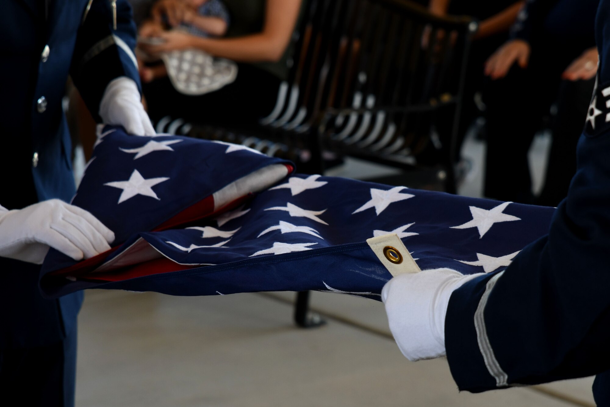 a photo of DM Base Honor Guardsmen folding the U.S. flag