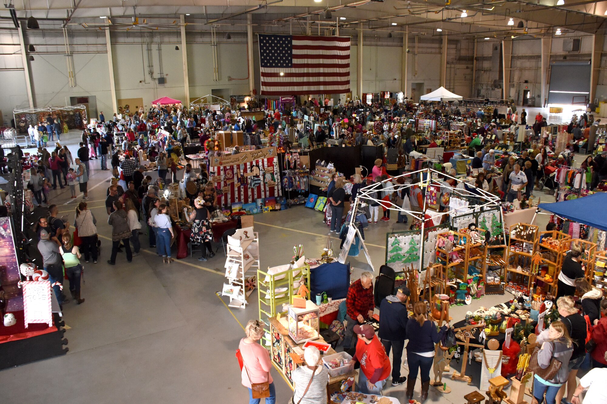 Shoppers at the 38th annual Santa’s Market explore the booths at the Louis F. Garland Department of Defense Fire Academy on Goodfellow Air Force Base, Texas, Nov. 17, 2018. This year’s market is expected to be even bigger, hosting 86 vendors from across Texas filling 126 booths. (U.S. Air Force photo by Airman 1st Class Seraiah Hines/Released)