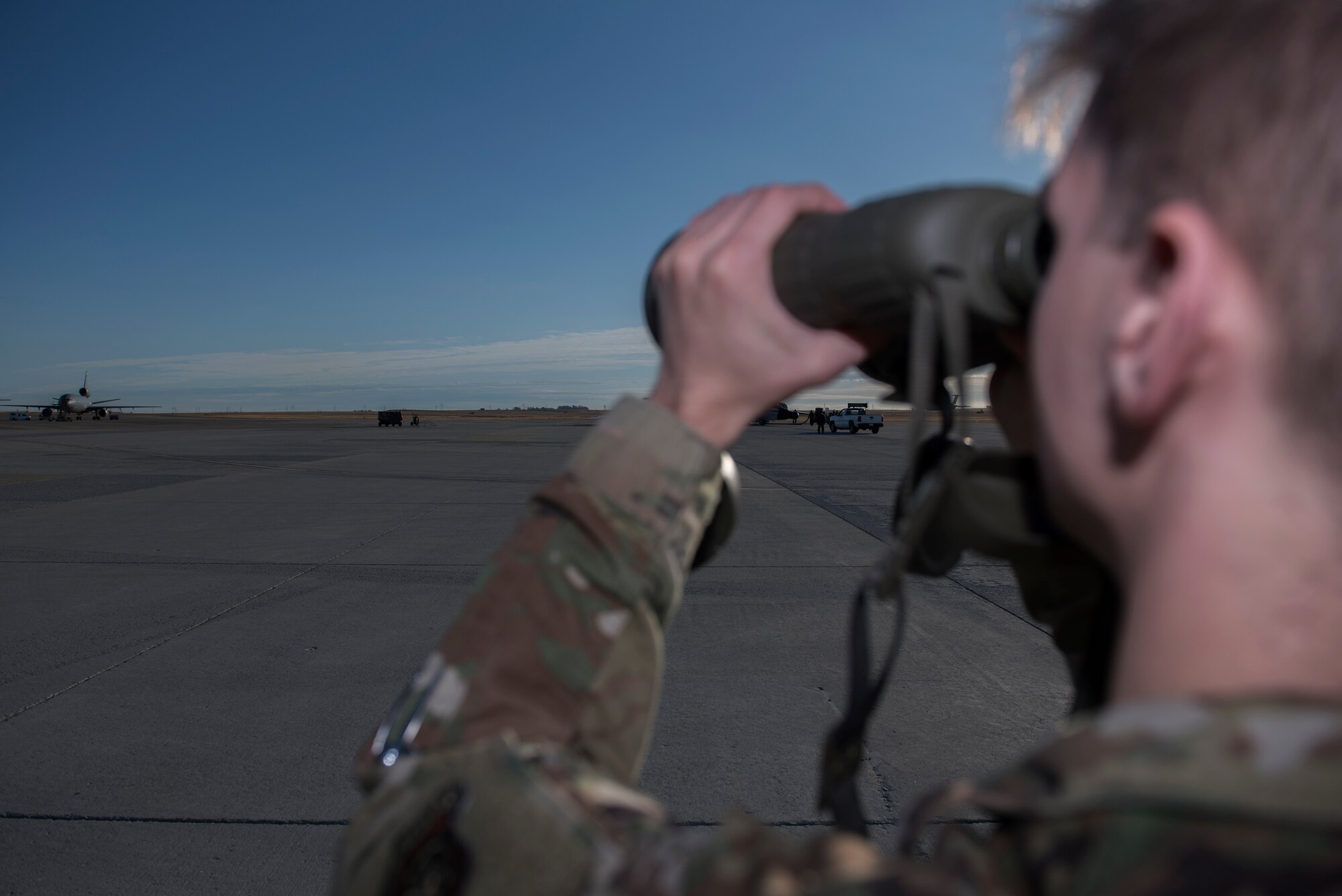 U.S. Air Force Staff Sgt. Christopher, 60th Operation Support Squadron weather forecaster, checks the thickness of the haze that is visible by the horizon Nov. 18, 2019, at Travis Air Force Base California. Haze is the thickness of fog seen near the horizon and is able to be measured by how much haze covers distant objects. (U.S. Air Force photo by Airman 1st Class Cameron Otte)