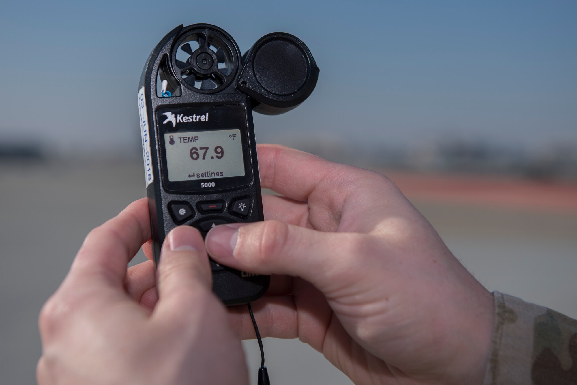 U.S. Air Force Senior Airman Dylan Marler, 60th Operation Support Squadron weather forecaster, tests the wind speed on a wind meter Nov. 18, 2019, at Travis Air Force Base California. Marler is able to detect when storms approach Travis AFB by testing when the local wind speeds pick up. (U.S. Air Force photo by Airman 1st Class Cameron Otte)