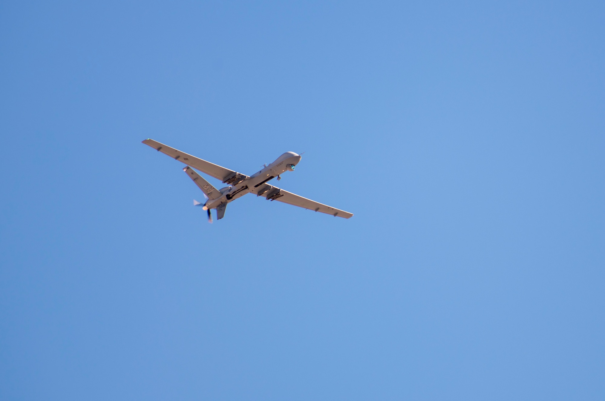 An MQ-9 Reaper flies through the skies over Aviation Nation, at Nellis Air Force Base, Nevada, Nov. 16, 2019. This was the first time an MQ-9 Reaper has ever flown at Aviation Nation. (U.S. Air Force photo by Staff Sgt. Omari Bernard)