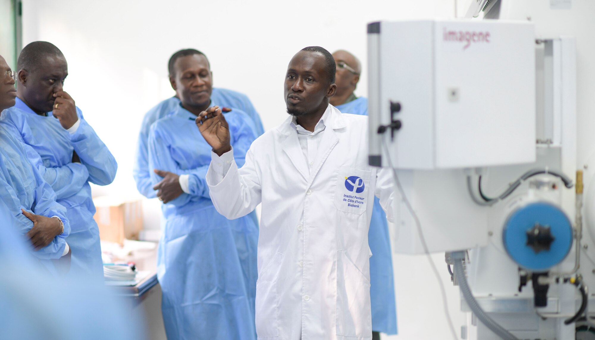 A member of the Pasteur Institute Lab gives a tour of the facility for participants of the African Partner Outbreak Response Alliance in Abidjan, Côte d'Ivoire, Nov. 20, 2019.