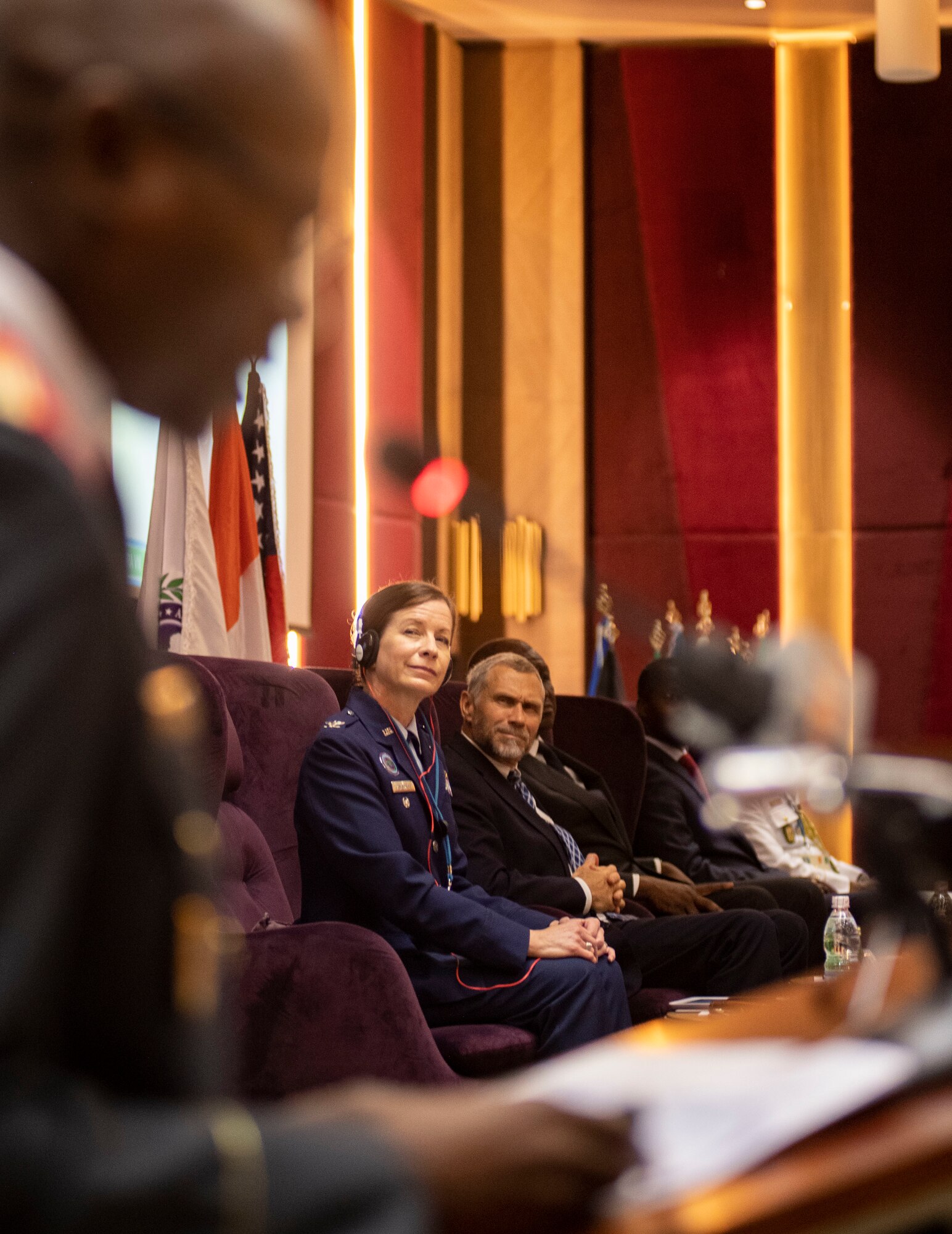 United States Ambassador to Côte d'Ivoire, the Honorable Richard K. Bell and U.S. Air Force Col. Krystal Murphy, U.S. Africa Command’s Deputy Command Surgeon, listen to welcoming remarks during the official opening ceremony of the African Partner Outbreak Response Alliance (APORA) conference, Abidjan, Côte d'Ivoire, Nov. 18, 2019.