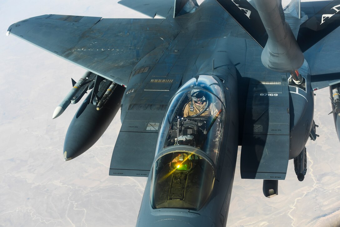 An F-15E Strike Eagle receives fuel from a KC-135 Stratotanker