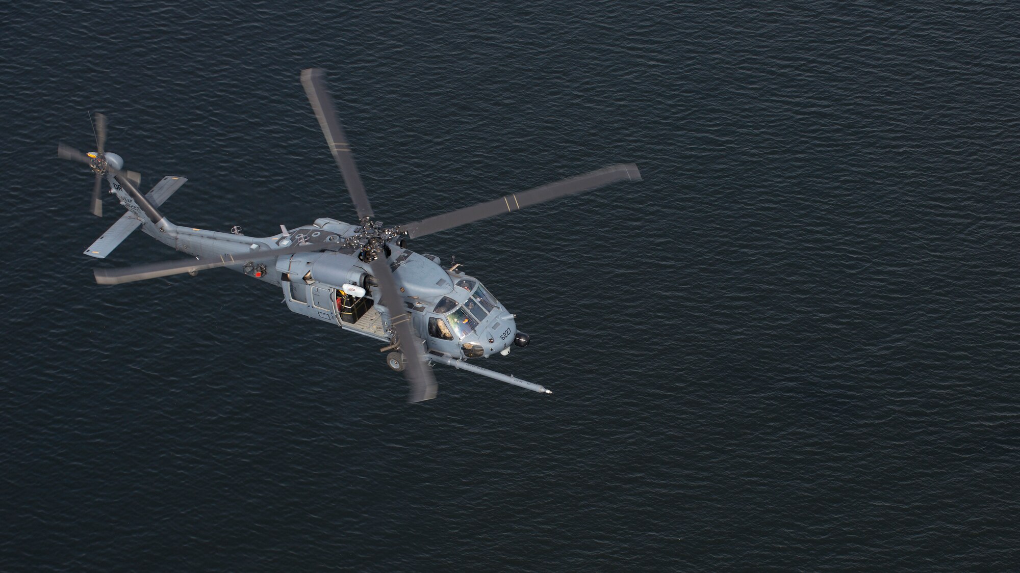 An HH-60 Pave Hawk helicopter assigned to the 305th Rescue Squadron (RQS), Davis-Monthan Air Force Base, Ariz., flies above the waters of Tampa Bay, Fla., Nov. 8, 2019.