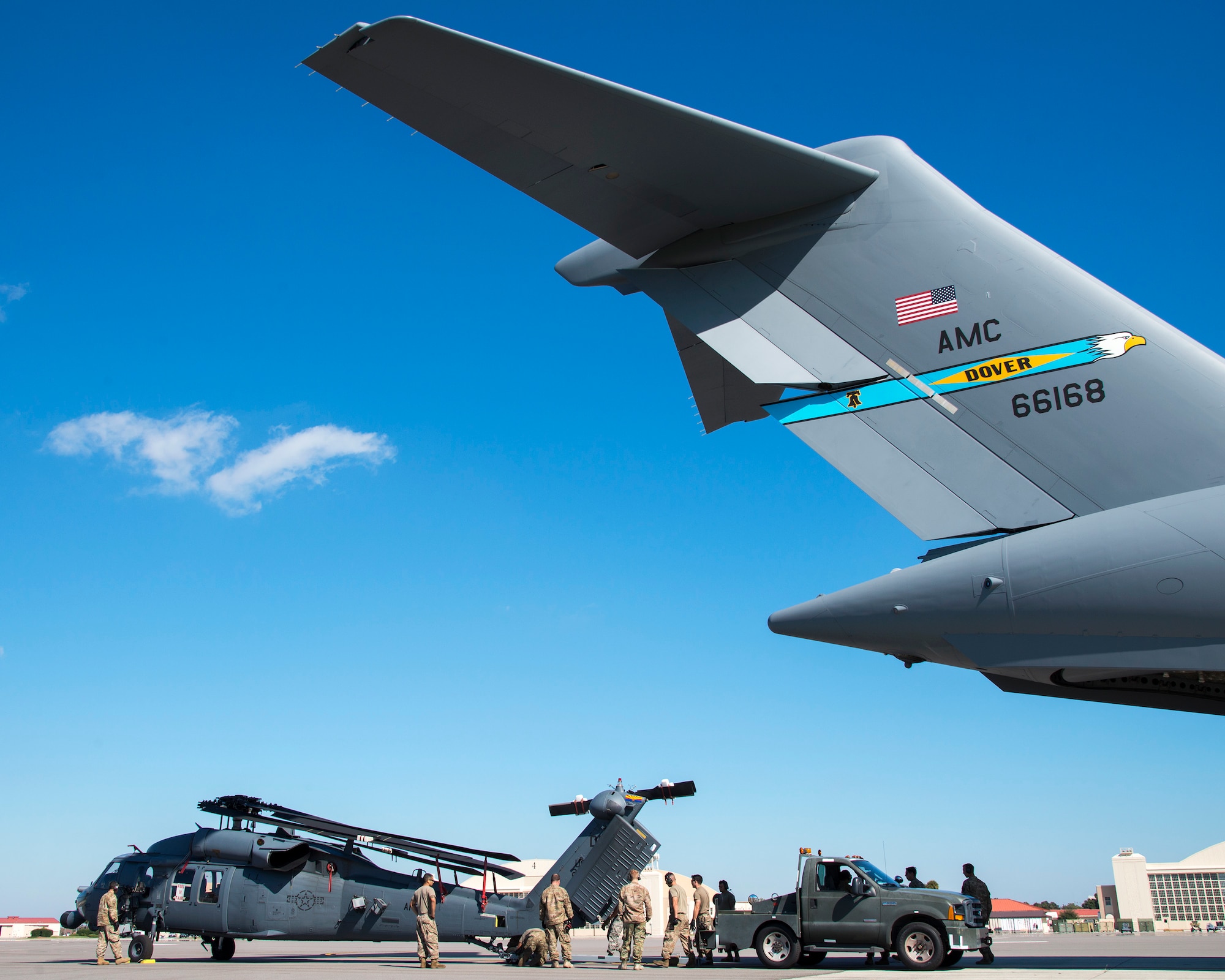 U.S. Air Force Airmen upload an HH-60 Pave Hawk helicopter assigned to the 305th Rescue Squadron (RQS), Davis-Monthan Air Force Base, Ariz., onto a C-17 Globemaster III assigned to the 436th Airlift Wing (AW), Dover Air Force Base, Dela., at MacDill Air Force Base, Fla., Nov. 20, 2019.