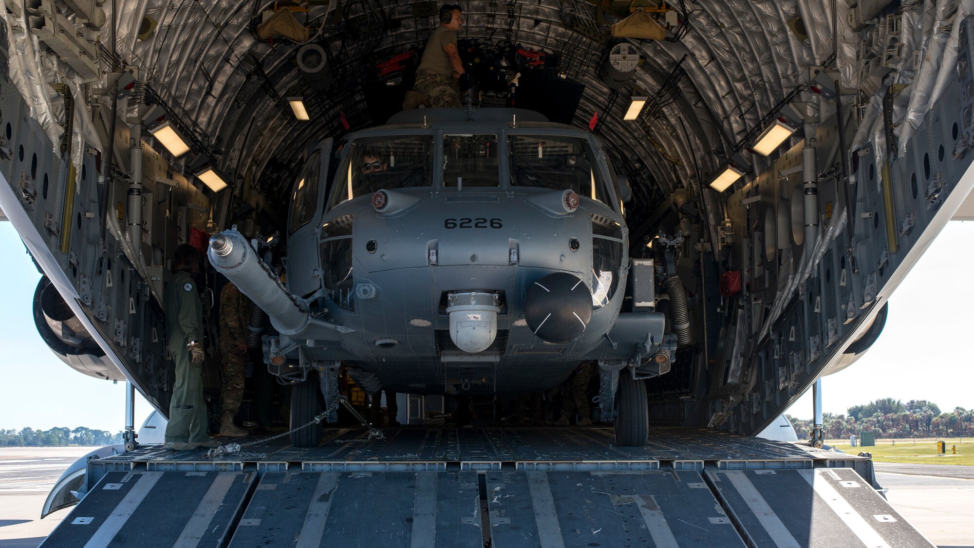 An HH-60 Pave Hawk helicopter assigned to the 305th Rescue Squadron (RQS), Davis-Monthan Air Force Base, Ariz., sits inside a C-17 Globemaster III assigned to the 436th Airlift Wing, Dover Air Force Base, Dela., at MacDill Air Force Base, Fla., Nov. 20, 2019.
