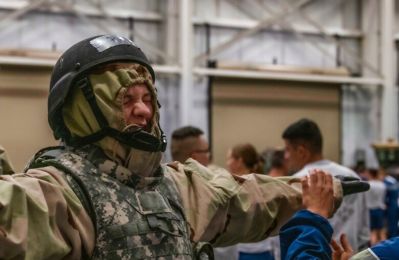 A 90th Mission Support Group Airman is evaluated on her ability to put on mission oriented protective posture gear during Warrior Day Nov. 21, 2019, on F.E. Warren Air Force Base, Wyo. There are five MOPP levels and every team was required to gear up to MOPP 4, the highest level, while being timed. The Warrior Readiness Program Team, is responsible for Warrior Day, decided to forgo the protective mask in MOPP 4 for sanitation purposes. (U.S. Air Force photo by Senior Airman Abbigayle Williams)