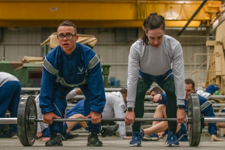 As part of 90th Mission Support Group’s Warrior Day, teams completed the warrior ethos challenge comprised of eight stations, including team workouts with partner deadlifts, high-five pushups and flutter kicks Nov. 21, 2019, on F.E. Warren Air Force Base, Wyo. Warrior Day is held once a quarter in order to educate 90th MSG Airmen on tactical operations and skills which may be critical when deployed. (U.S. Air Force photo by Senior Airman Abbigayle Williams)