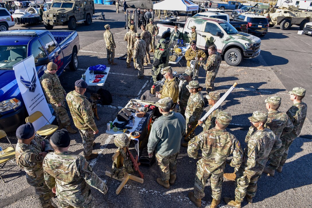 Military members show gear to ROTC cadets.
