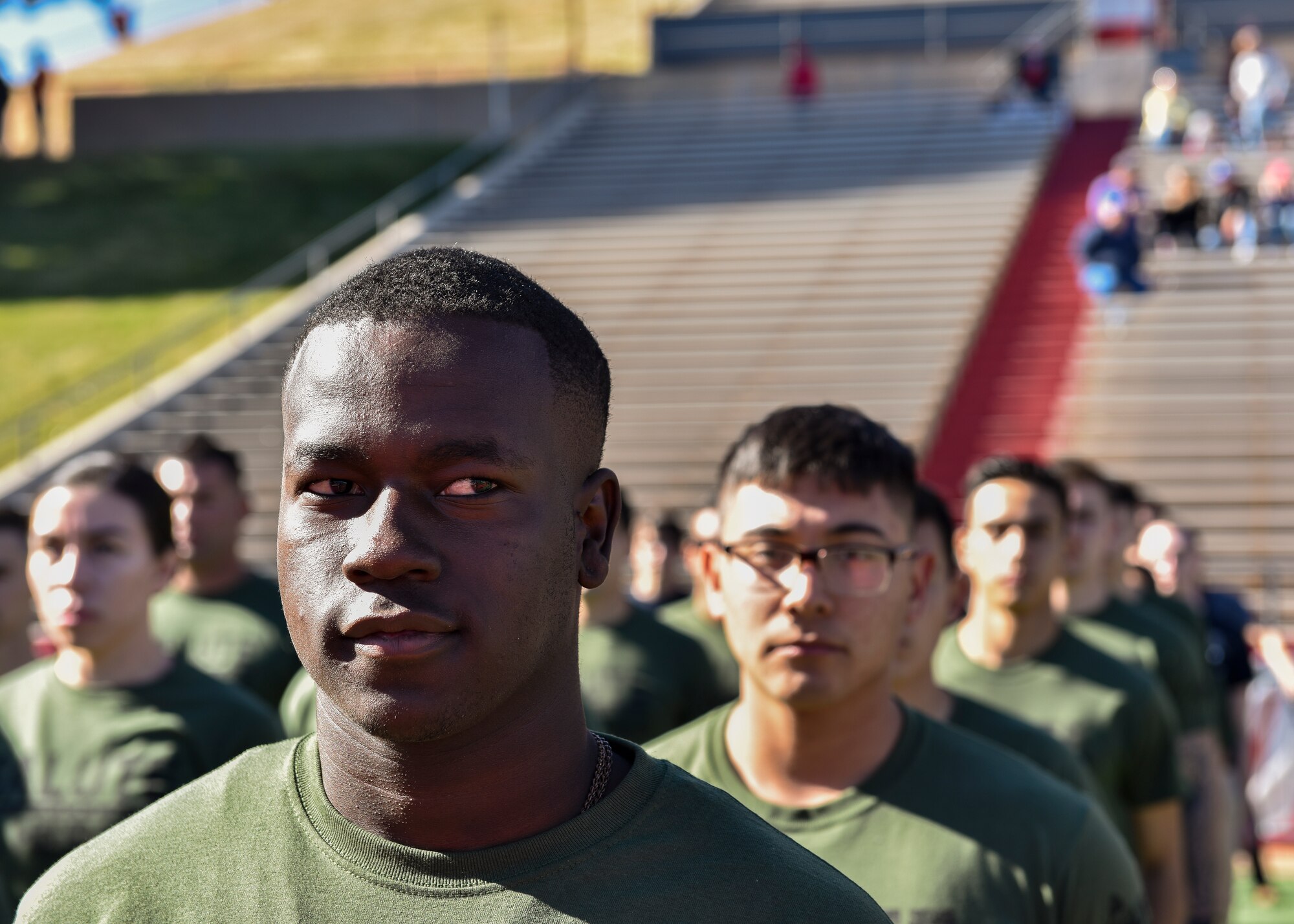 Military recruit stands in formation.