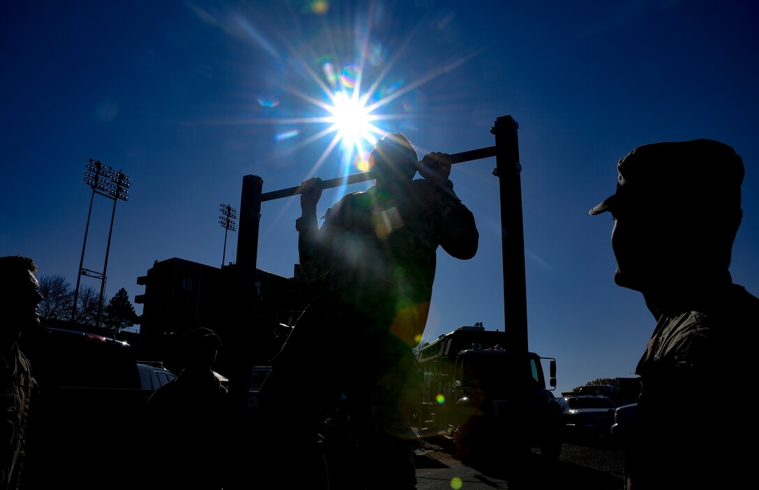Photo of ROTC cadet doing pull ups.