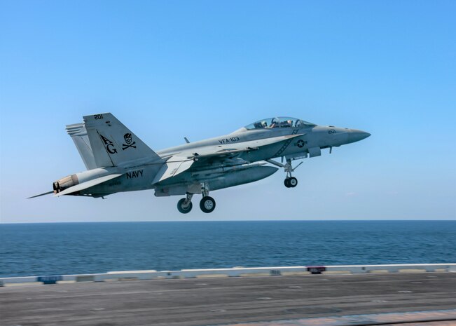 An F/A-18F Super Hornet attached to the "Jolly Rogers" of Strike Fighter Squadron (VFA) 103 launches from the flight deck of the aircraft carrier USS Abraham Lincoln (CVN 72). Abraham Lincoln Carrier Strike Group is deployed to the U.S. 5th Fleet area of operations in support of naval operations to ensure maritime stability and security in the Central Region, connecting the Mediterranean and the Pacific through the western Indian Ocean and three strategic choke points. With Abraham Lincoln as the flagship, deployed strike group assets include staffs, ships and aircraft of Carrier Strike Group 12 (CSG 12), Destroyer Squadron 2 (DESRON 2), USS Leyte Gulf (CG 55) and Carrier Air Wing 7 (CVW 7).