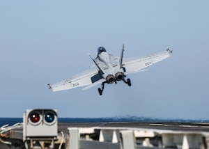 An F/A-18F Super Hornet attached to the "Jolly Rogers" of Strike Fighter Squadron (VFA) 103 launches from the flight deck of the aircraft carrier USS Abraham Lincoln (CVN 72). Abraham Lincoln Carrier Strike Group is deployed to the U.S. 5th Fleet area of operations in support of naval operations to ensure maritime stability and security in the Central Region, connecting the Mediterranean and the Pacific through the western Indian Ocean and three strategic choke points. With Abraham Lincoln as the flagship, deployed strike group assets include staffs, ships and aircraft of Carrier Strike Group 12 (CSG 12), Destroyer Squadron 2 (DESRON 2), USS Leyte Gulf (CG 55) and Carrier Air Wing 7.