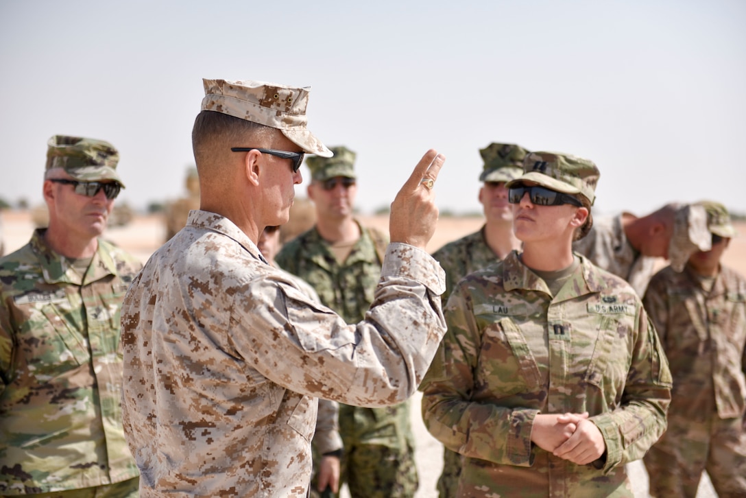 Lt. Gen. Carl E. Mundy III, commander of Marine Corps Forces Central Command, meets with service members at a missile defense site at Prince Sultan Air Base, Saudi Arabia on Nov. 6, 2019. PSAB will serve as a strategic operating location for U.S. Air Forces Central Command and U.S. Central Command and fills a mutually beneficial role of countering destabilizing regional activity. (U.S. Air Force photo by Tech. Sgt. John Wilkes)