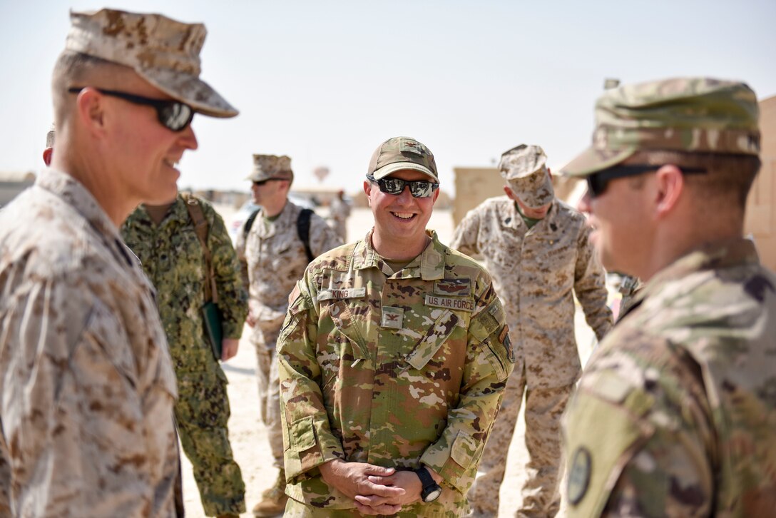 Col. Jason King, commander of the 378th Air Expeditionary Group, speaks with Lt. Gen. Carl E. Mundy III, commander of Marine Corps Forces Central Command, during a visit to Prince Sultan Air Base, Saudi Arabia on Nov. 6, 2019. PSAB will serve as a strategic operating location for U.S. Air Forces Central Command and U.S. Central Command and fills a mutually beneficial role of countering destabilizing regional activity. (U.S. Air Force photo by Tech. Sgt. John Wilkes)