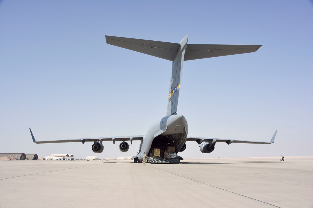Airmen prepare to download equipment from a C-17 Globemaster III after landing at Prince Sultan Air Base, Saudi Arabia on Nov. 7, 2019. PSAB will serve as a strategic operating location for U.S. Air Forces Central Command and U.S. Central Command and fills a mutually beneficial role of countering destabilizing regional activity. (U.S. Air Force photo by Tech. Sgt. John Wilkes)
