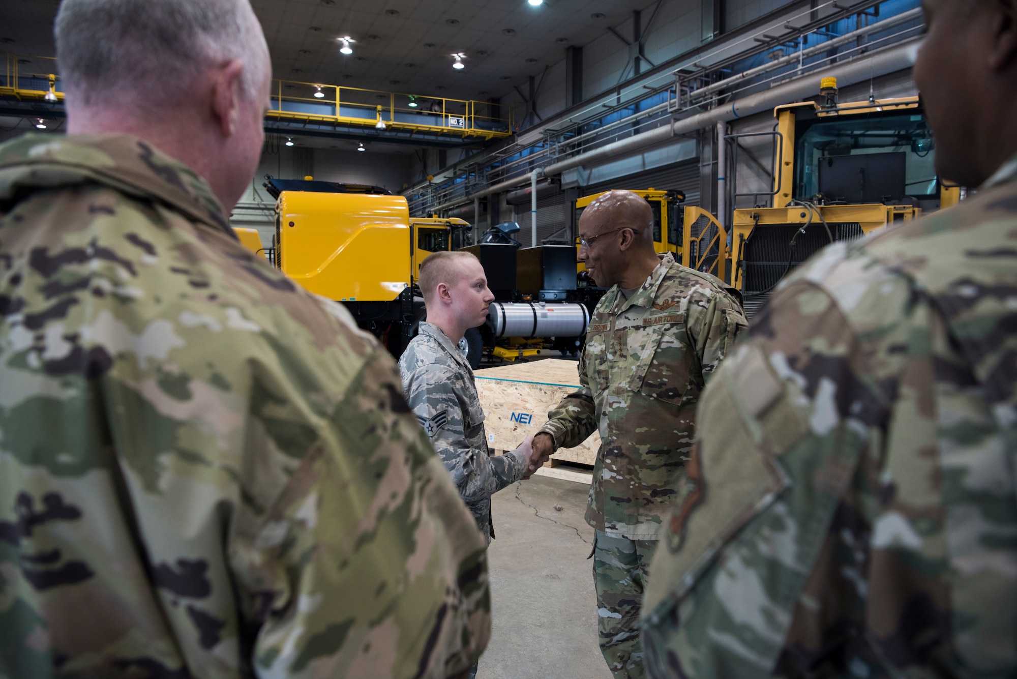 U.S. Air Force Senior Airman William Gage, 35th Logistic Readiness Squadron fleet management and analysis journeyman, shakes hands with Gen. CQ Brown Jr., Pacific Air Forces commander, while being coined at Misawa Air Base, Japan, Nov. 14, 2019. Gage was highlighted by his unit’s leadership for his determination, motivation and exceptional work performance. (U.S. Air Force Photo by Senior Airman Collette Brooks)