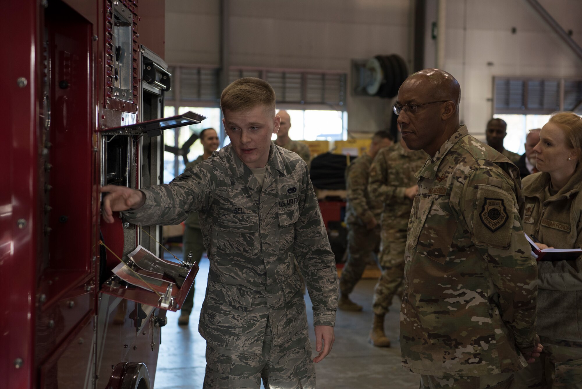U.S. Air Force Airman 1st Class Bradley Bell, 35th Logistic Readiness Squadron vehicle maintenance apprentice, points to a water hose panel on a fire truck at Misawa Air Base, Japan, Nov. 14, 2019. Bell showcased functions of the fire truck while discussing new and improved advances being made within his unit to better equip the squadron to perform optimally. (U.S. Air Force Photo by Senior Airman Collette Brooks)